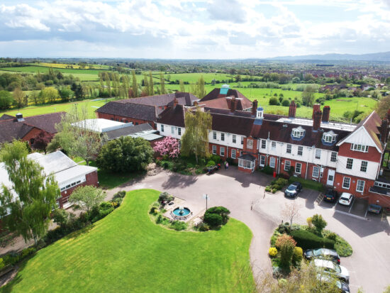 New College Worcester and surrounding fields from a high angle on a sunny day