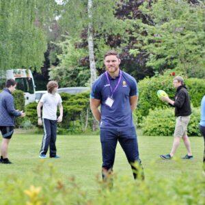 Students playing Hugby with Warriors player, Darren Barry