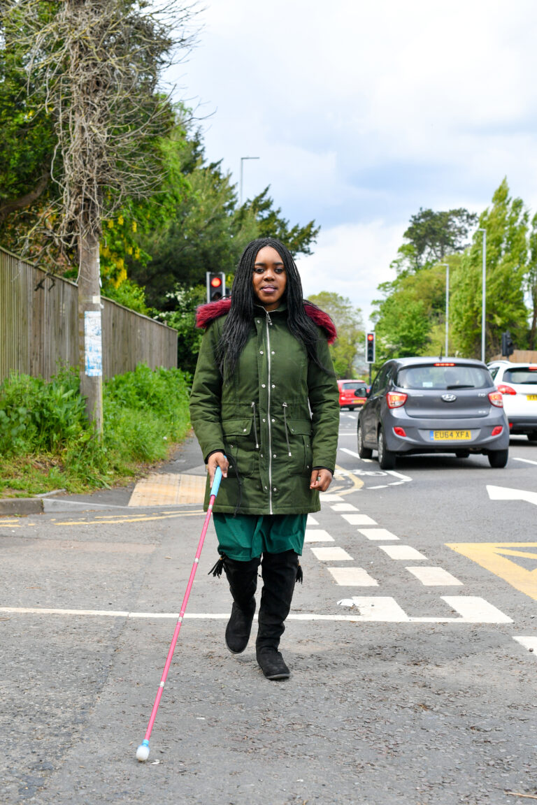 Student using white cane