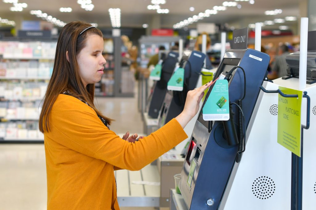 Student using self service checkout