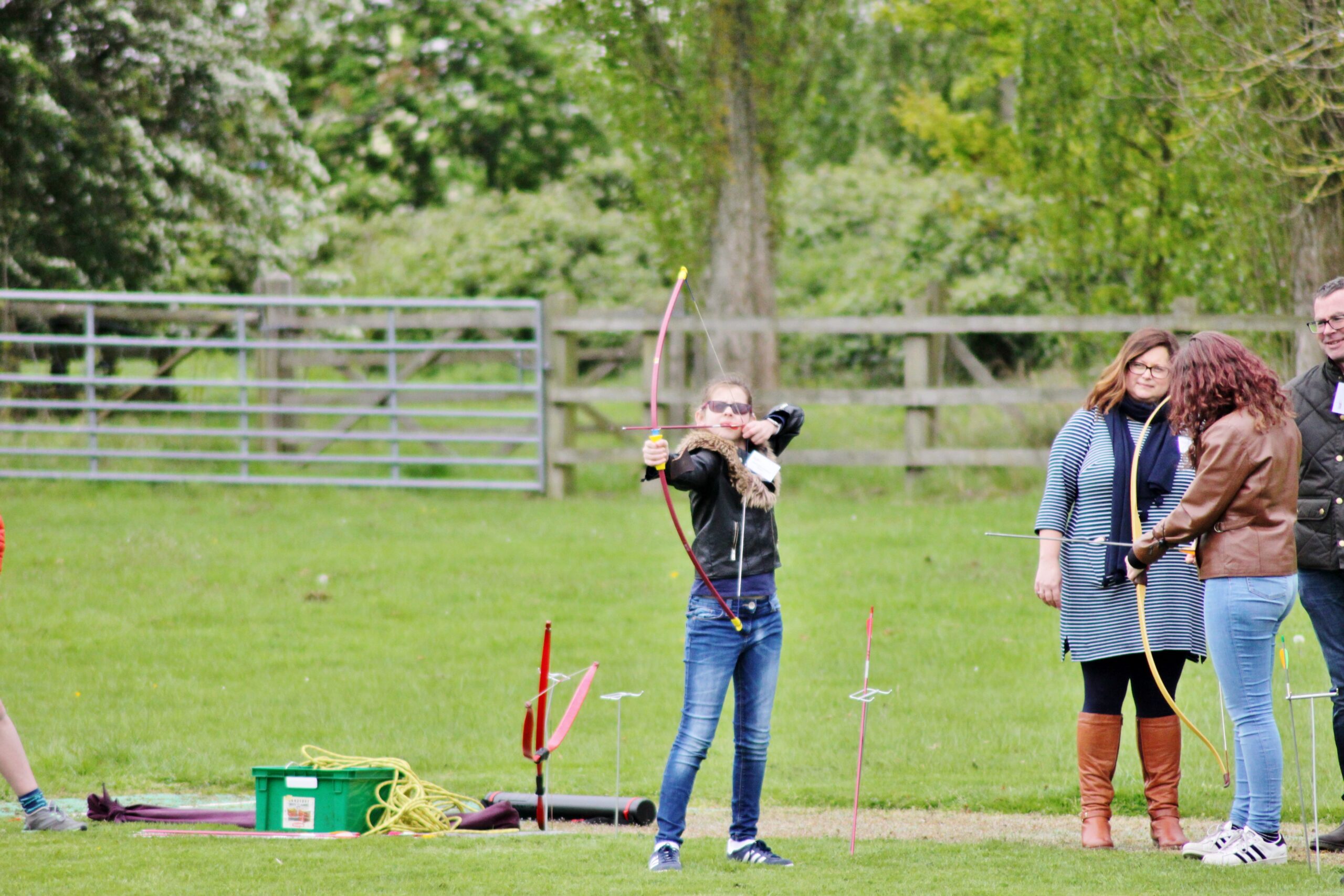 Young person doing Archery on the playing fields at NCW