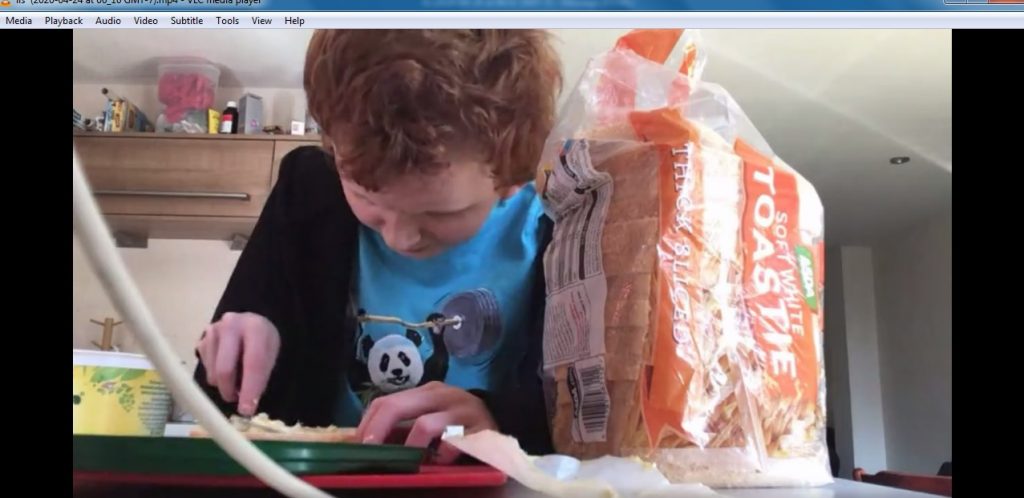 Joe learning to butter bread via video link