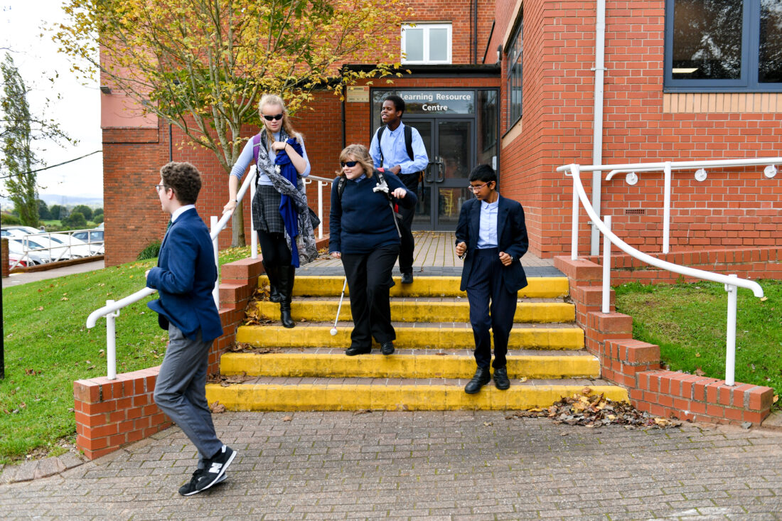 Students walking down steps