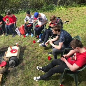 Students gathered around the fire, talking