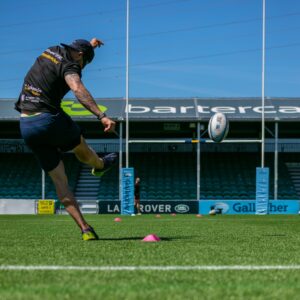 Action shot of booting the rugby ball over the goal!