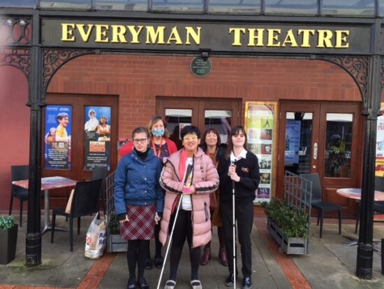 Group of NCW students are stood outside the Everyman Theatre before the performance