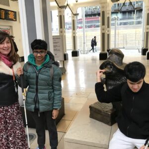 Sonali and Mustafa with the Paddington Bear statue