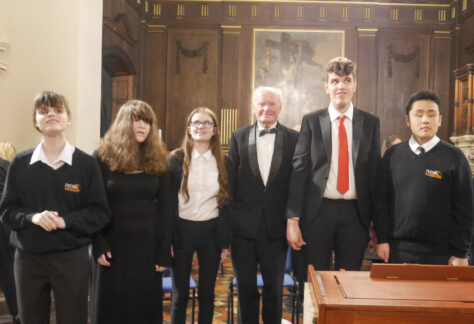 The Messiah performers with Geoff, member of the choir, smiling at the camera
