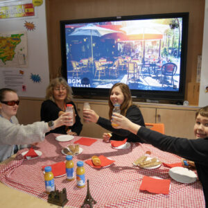 Students and Miss Gilbert cheersing their breakfast drinks