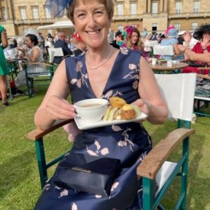 Rosie is just about to tuck into some tea and cake outside on the lawn