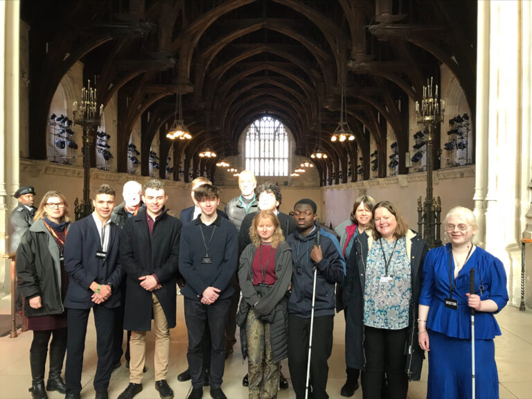 Students are shown in Westminster Hall, high up the steps from which President Zelensky spoke last week