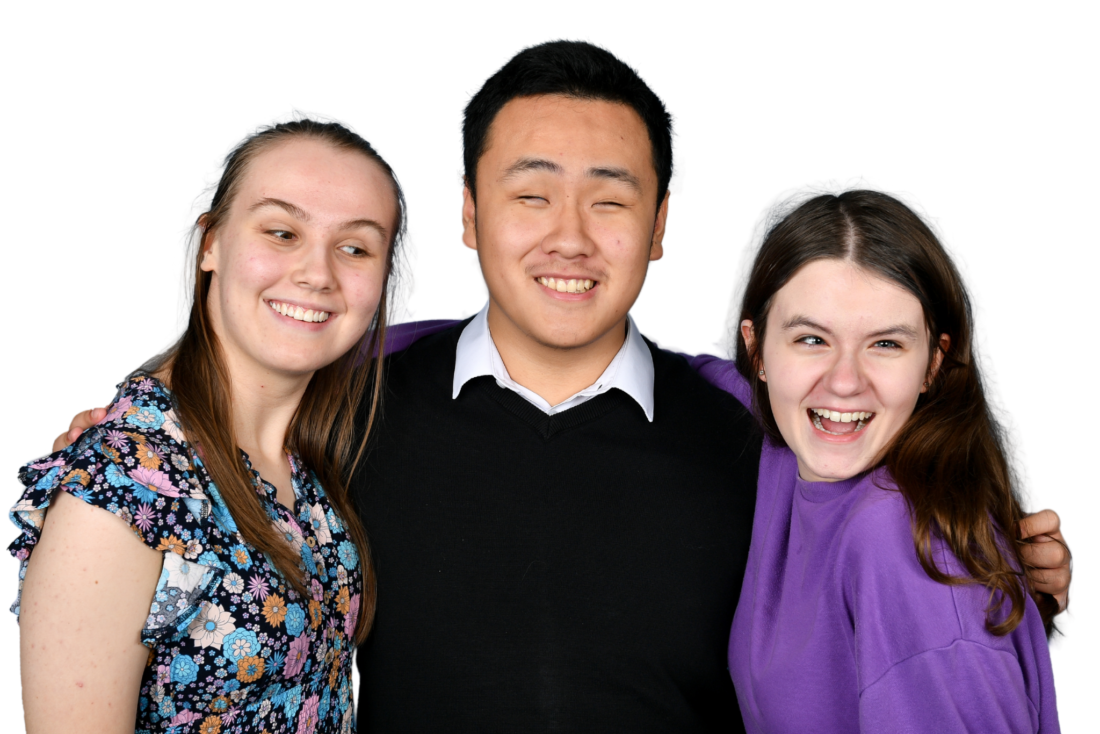 image of three students smiling at the camera