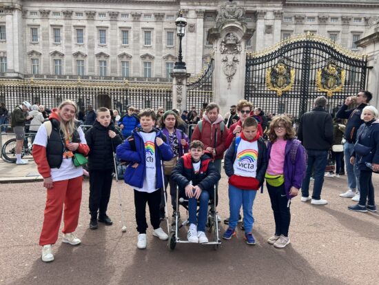 image of students stood in a group outside Buckingham Palace