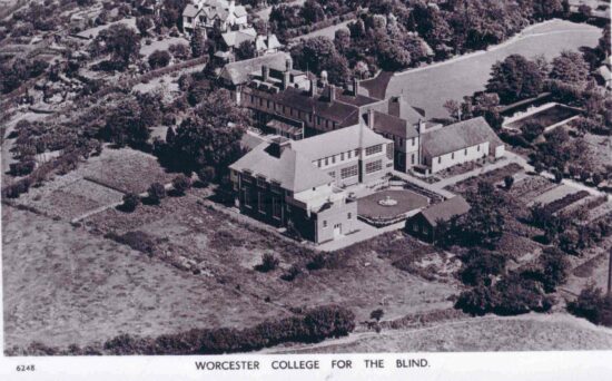 Black and White post card of an areil shot of the the College