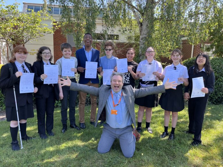 Photo of Mr Painter and students in a group smiling holding their certificates
