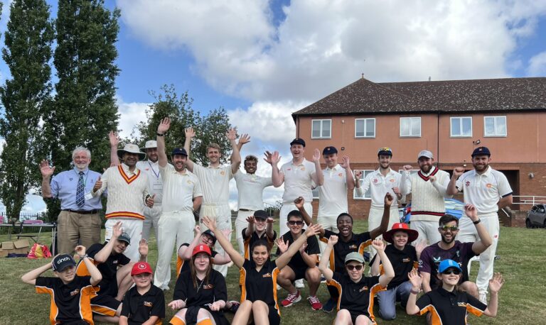 Group photo of students and MCC players