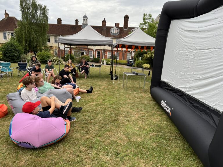 Students sat on chairs and beanbags enjoying the show