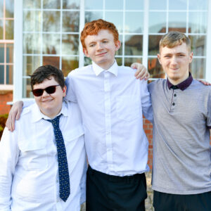 Photo of three students smiling