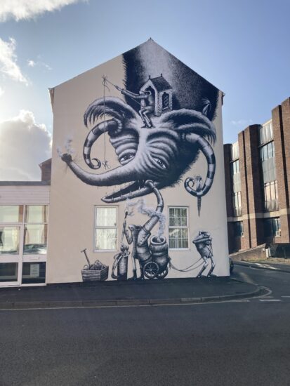 A photo of street art of a an elephant