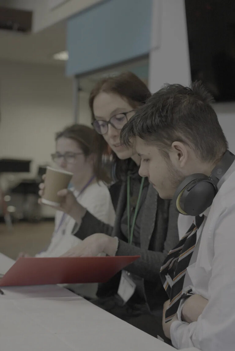 students during the filming sat around a table