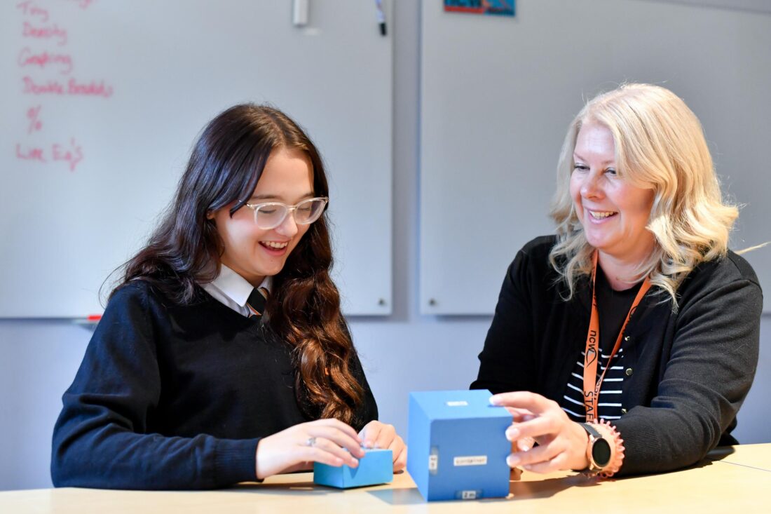 Photo of a student and staff working together in a lesson