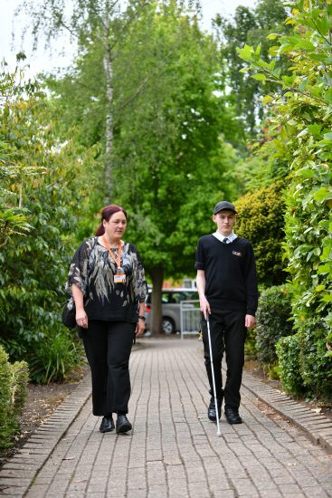 a student on a mobility lesson with a teacher