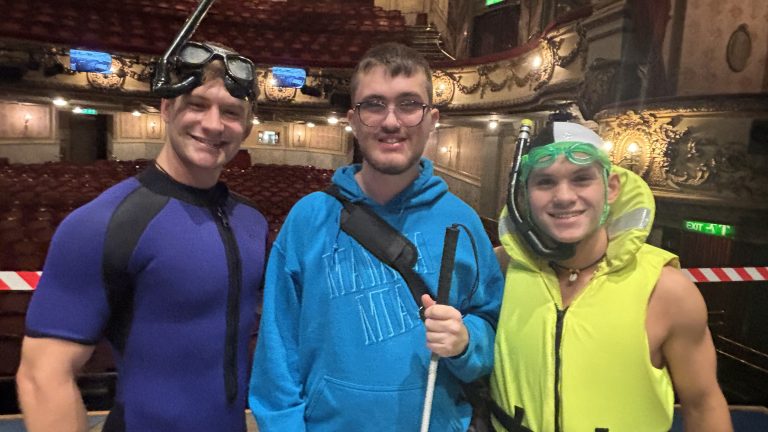 Photo of Zac with cast members dressed in snorkel gear
