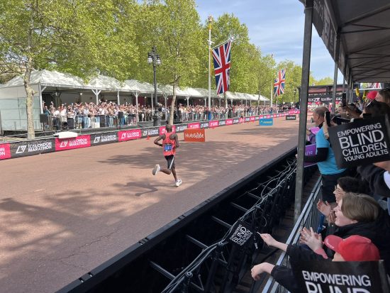 Students sat in the grandstand watching the runners