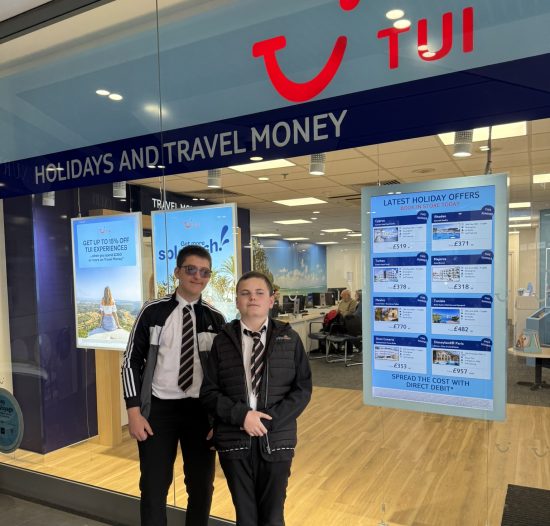 Photo of Lawson and Dom outside the Tui store