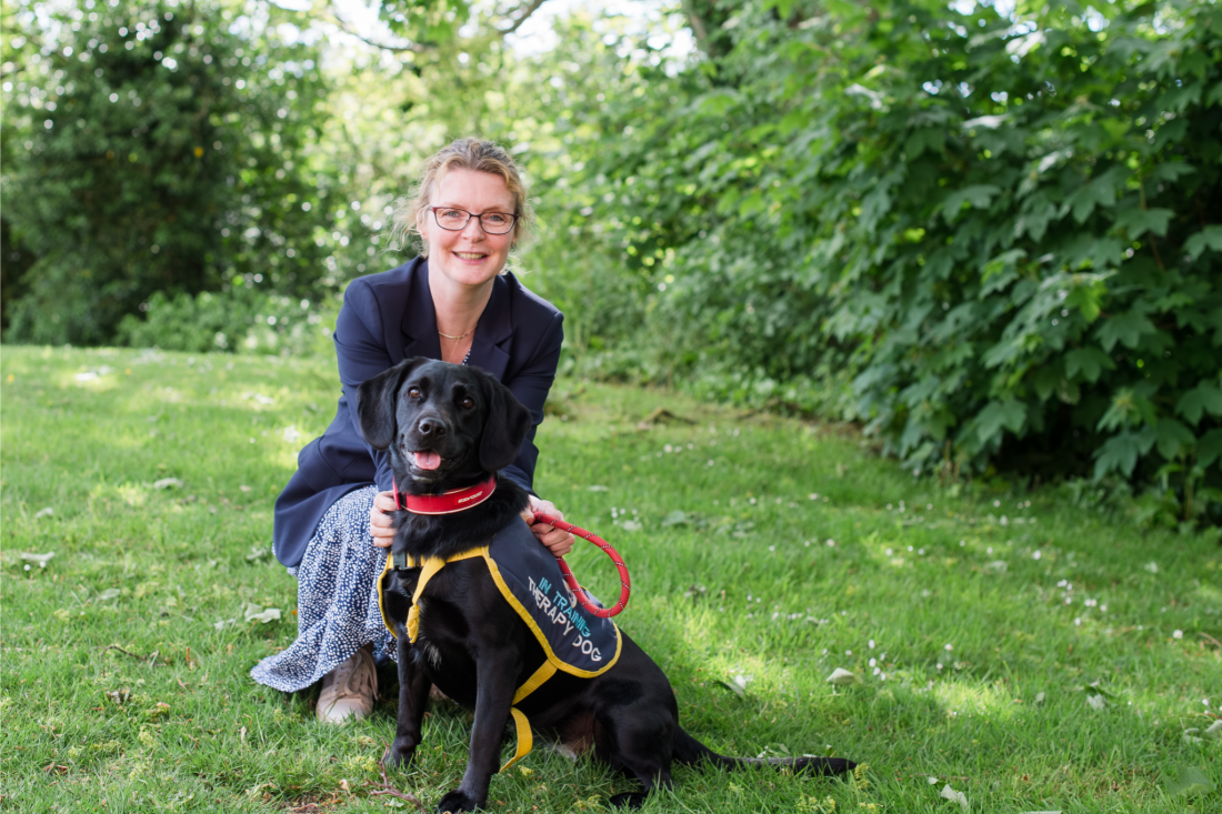 Photo of Principal Rachel Perks and NCW therapy school dog Tilly