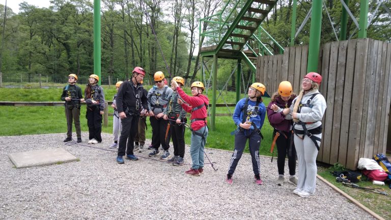 Students look up towards the highropers