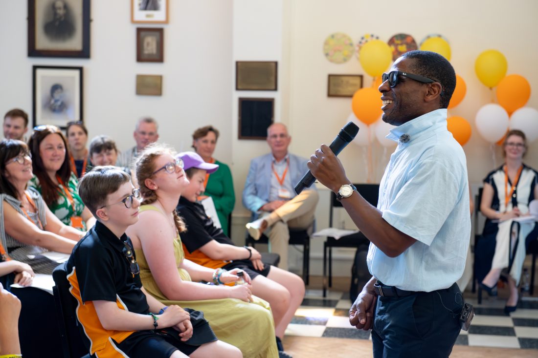 Photo of Darren Harris delivering his speech in the chapel