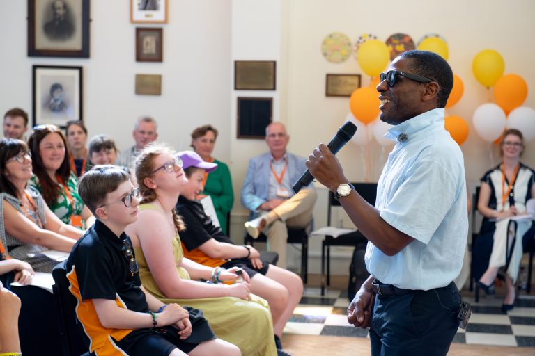 Photo of Darren Harris delivering his speech in the chapel