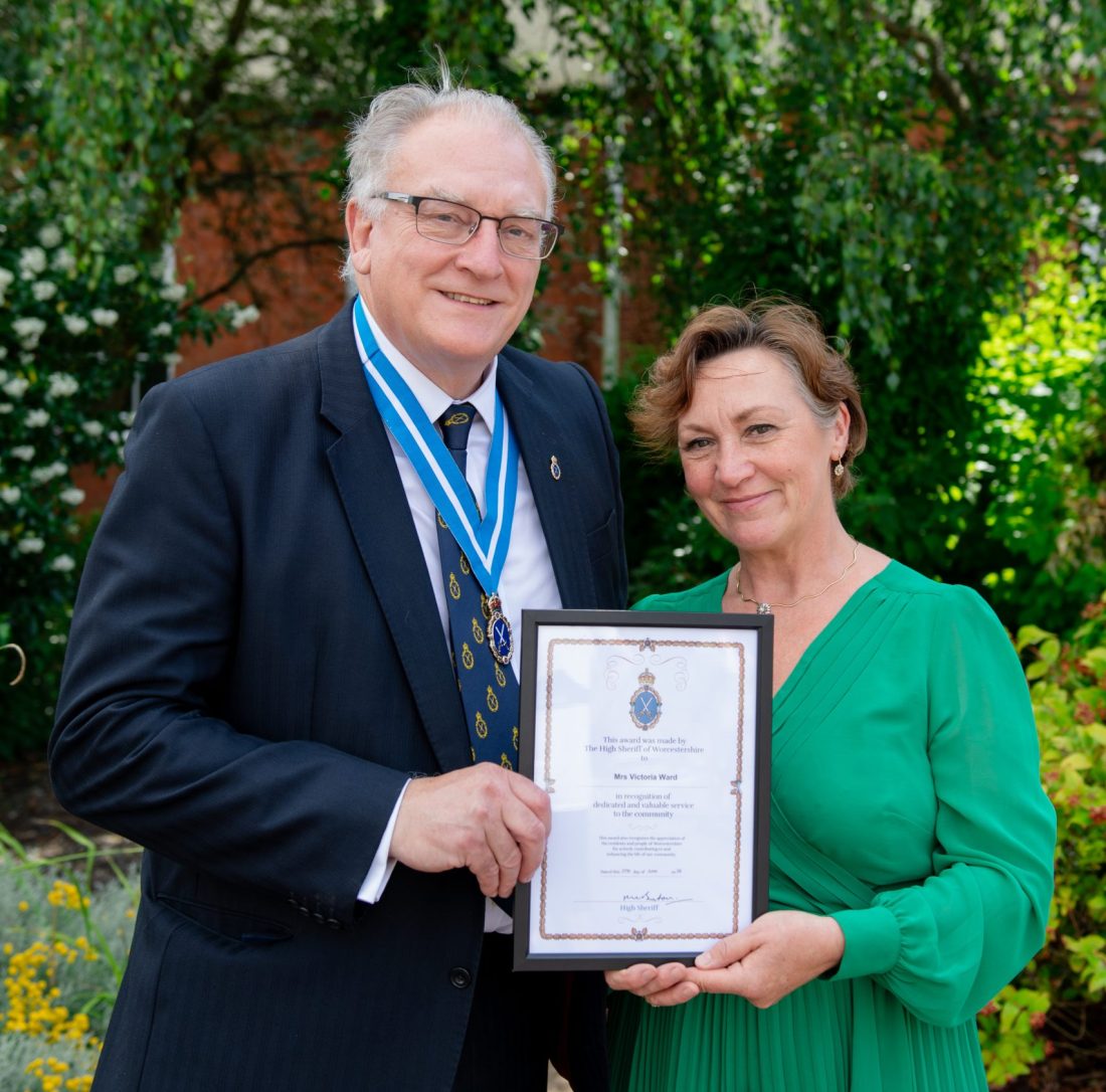 Photo of the HIgh Sheriff of Worcestershire and Victoria Ward smiling with the award