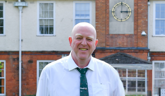 photo of Phil outside of the NCW building smiling