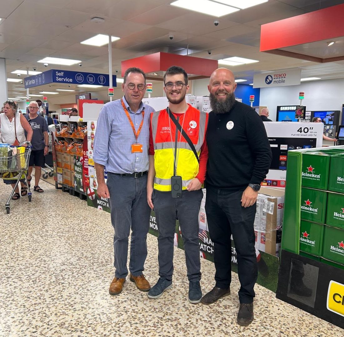 Mr Radford, Zac and Steve the Manager smiling for a photo on the shop floor