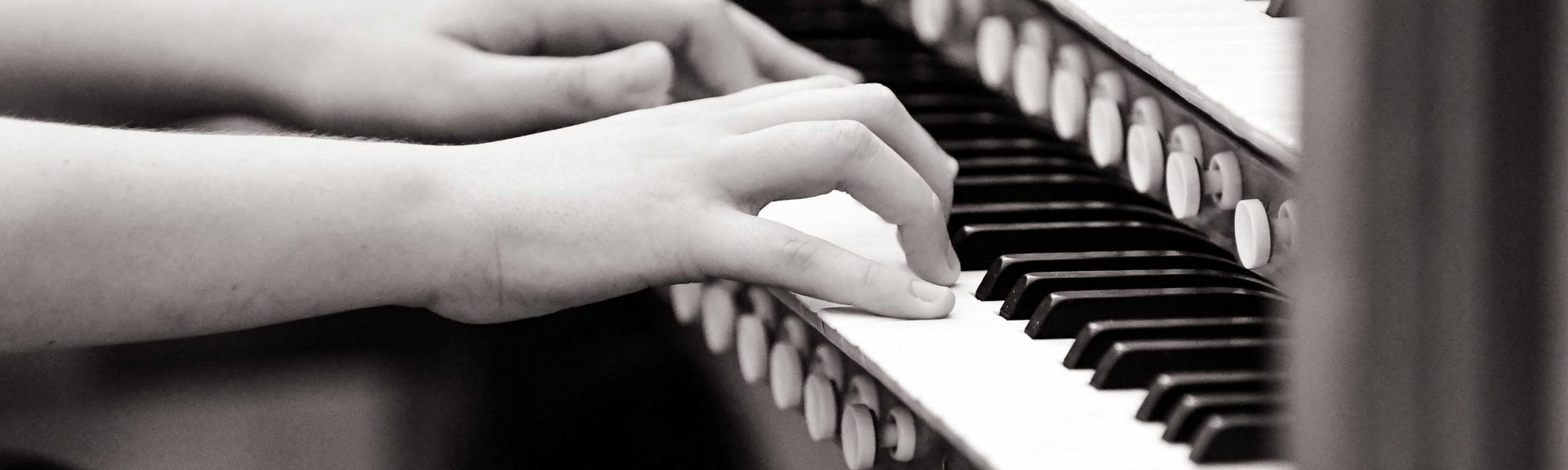 Close up of student playing piano